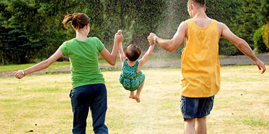 Parents playing with their child