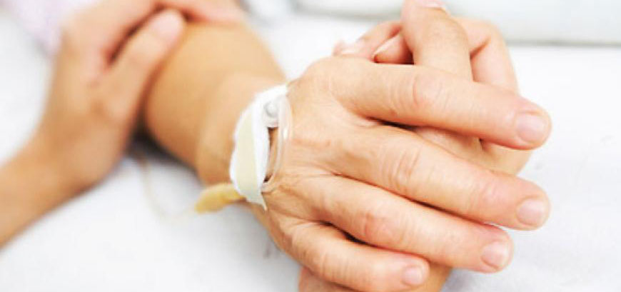 Holding the hand of a patient