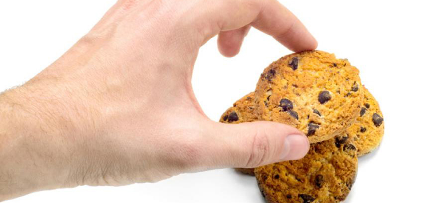 Hand grabbing cookies